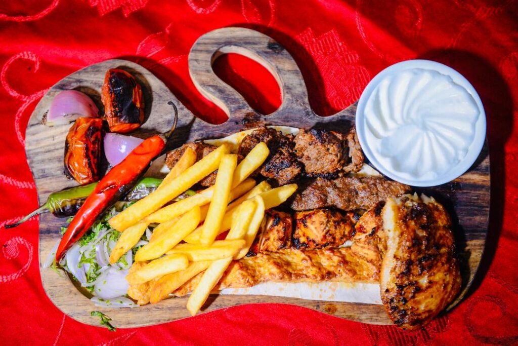Mixed Grill Hadramawt, a platter of Grilled Chicken Kebab, Chicken Mosahab, Shish Tawook, Orlaf Kebab, French Fries, Chillies and Onions, served at Hadramawt Palace, Jalan Bukit Bintang, Kuala Lumpur