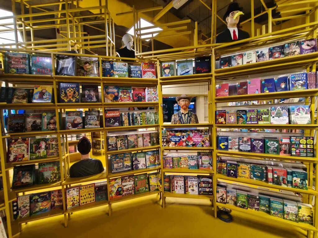 Busts and other art pieces and beautifully illustrated coffee-table books line the artful shelves of BookXcess LaLaport BBCC.