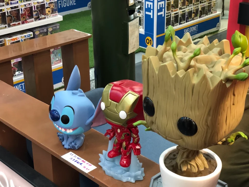 Collectible figurines of Stitch, Iron Man and Baby Groot on display at Sheldonet, LaLaport BBCC