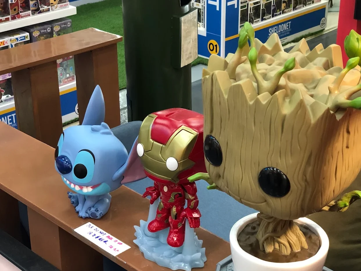 Collectible figurines of Stitch, Iron Man and Baby Groot on display at Sheldonet, LaLaport BBCC