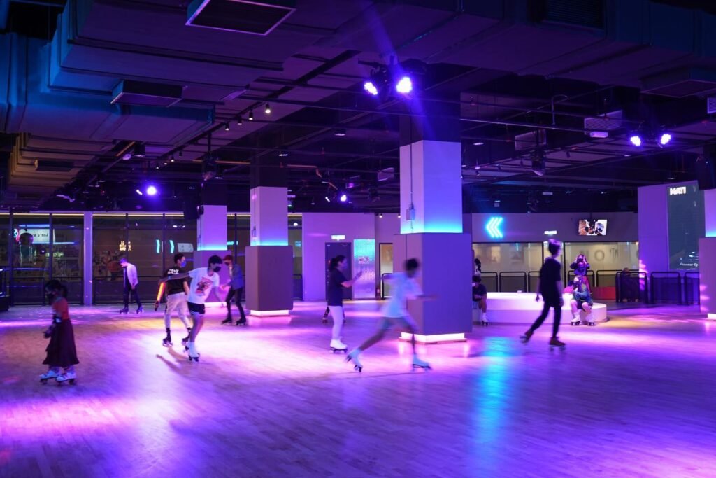 Korea’s popular indoor quad skating chain Rollerwa, featuring a spacious neon-lit rink and energetic Korean music, surrounded by colourful décor and nostalgic charm, located at LaLaport BBCC