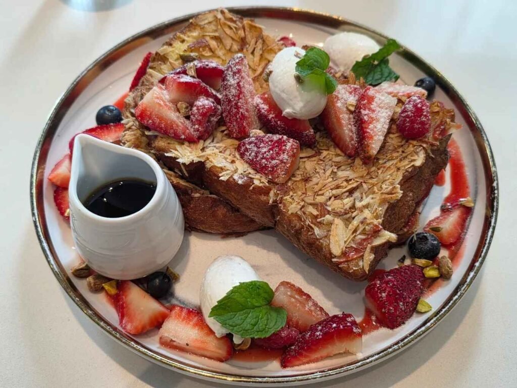 Almond Crusted French Toast, fluffy brioche toast coated with hand-sliced almonds served with mascarpone cream, mélange of forest berries & gula melaka syrup. Available at Wizards Tribeca, Jalan Imbi, Bukit Bintang