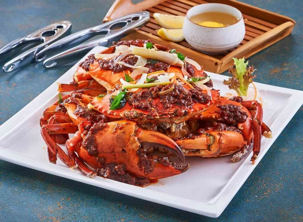 Bi Feng Tang Style Sea Crab, a traditional Hong Kong dish made up of a crab that has been butchered into shaggy pieces, tossed in starch, deep fried and, finally, stir-fried with a deluge of fried garlic and chilli.