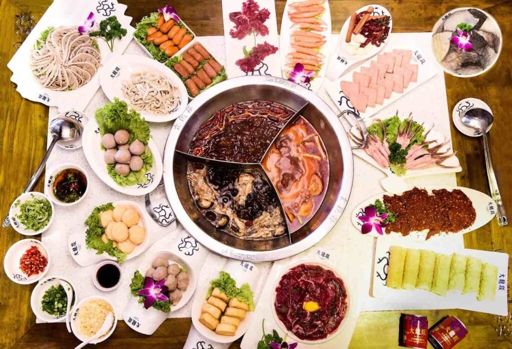 Da Long Yi Tri-Pot with various hotpot ingredients