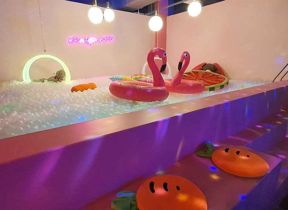 Malaysia's first ever Glowing Ball Pool, filled with 300,000 balls, giant inflatables and cool LED glowing chairs and effects.