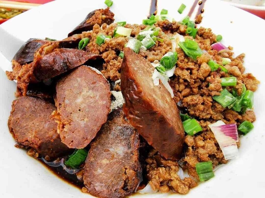 Imbi Road Pork Ball Noodles The famous Imbi Road Pork Ball Noodles Chinese Roasted Liver Sausage, garnished with savoury minced pork, deep-fried pig intestines and fresh spring onions. A signature dish at Restoran Win Heng Seng, Jalan Imbi, Bukit Bintang.