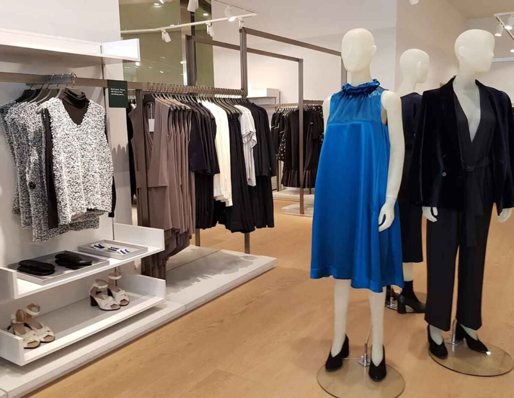 Women’s fashion display featuring sleeveless dresses, maxi dresses, mini dresses, midi dresses, shirt dresses, long sleeve and collared styles, a-line and jersey dresses, jumpsuits, and linen pieces at COS Pavilion Elite, Malaysia’s first COS store in Bukit Bintang, Kuala Lumpur.