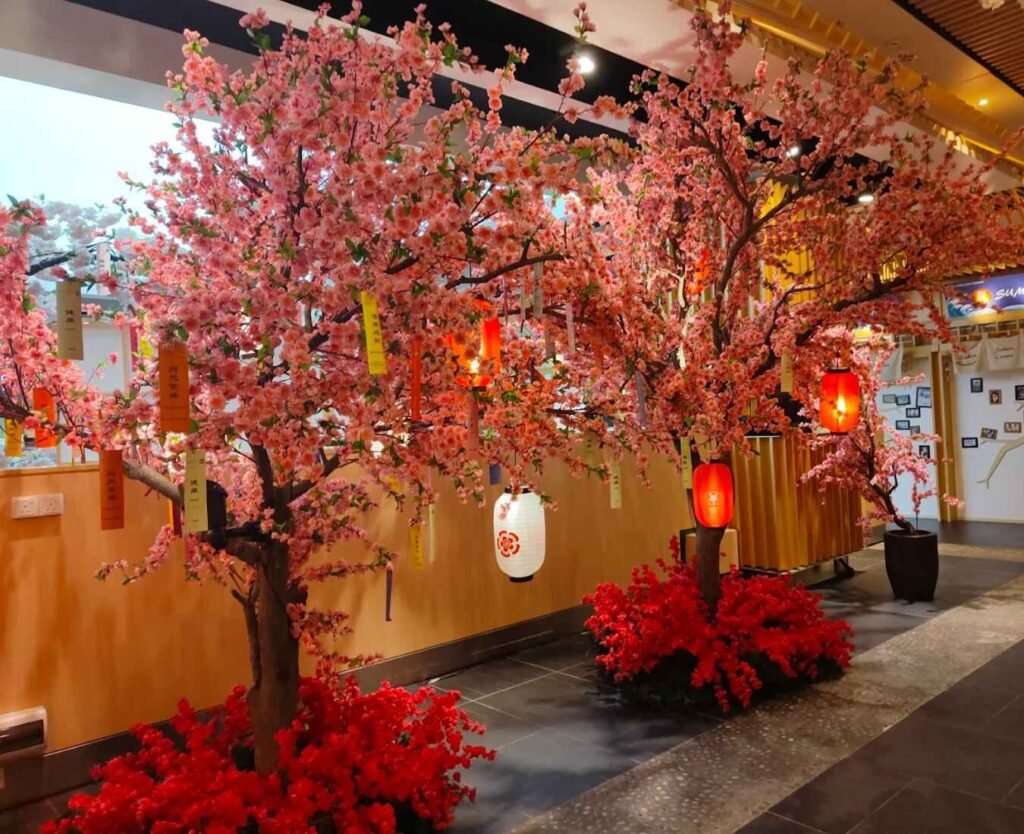 Pink sakura trees with red and white chochin lanterns Tokyo Street Pavilion Kuala Lumpur
