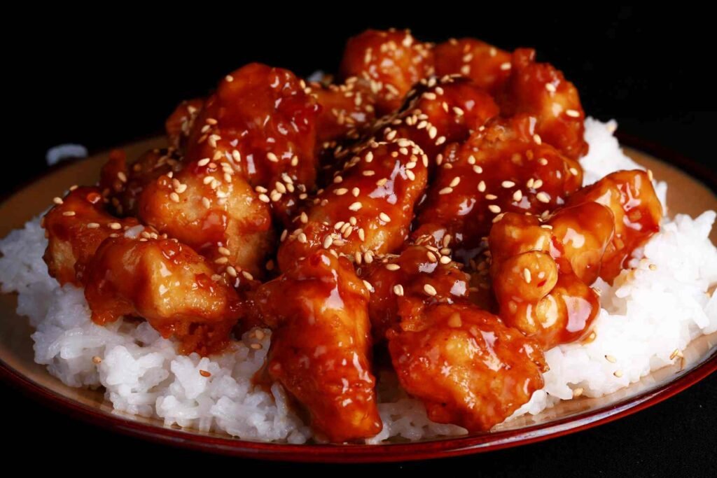 Honey-glazed sesame chicken with steamed white rice and from Chong Kee Chicken Rice at Food Place Pavilion KL.