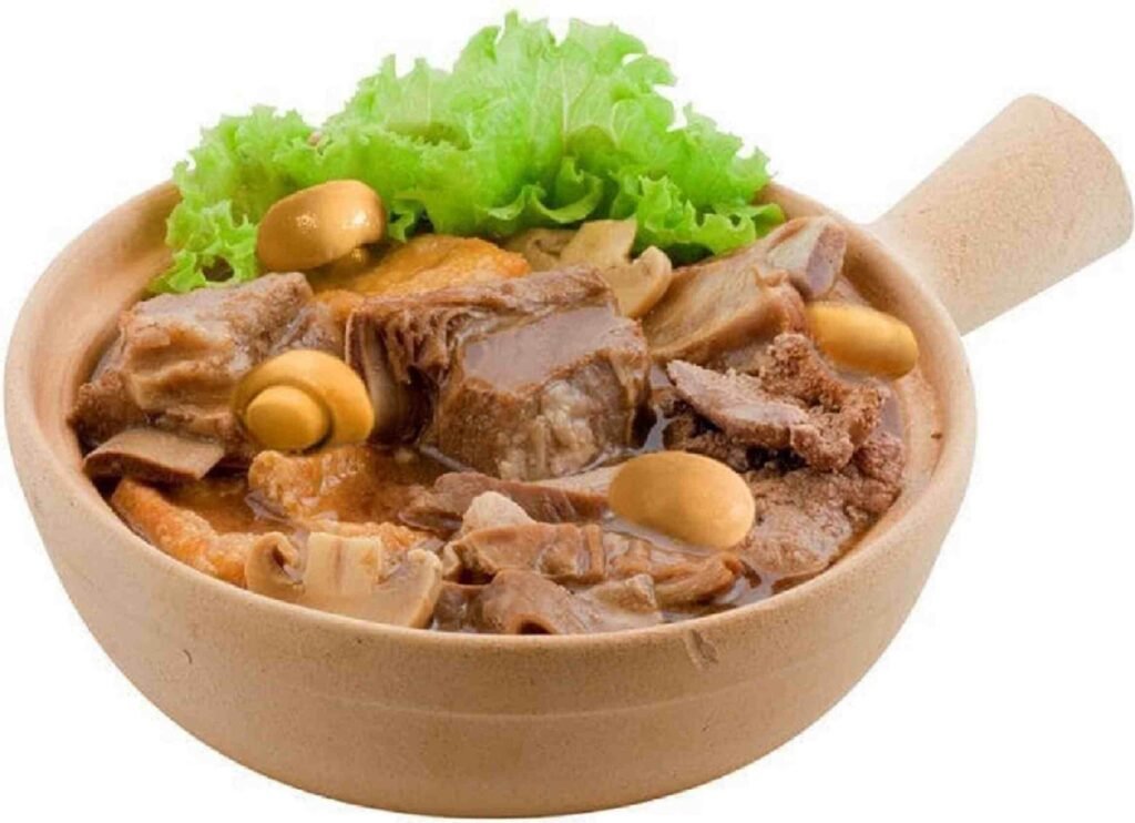 Claypot Bak Kut Teh is a beloved Malaysian-Chinese herbal soup featuring tender pork ribs slow-simmered in a rich, aromatic broth and traditionally served piping hot in a claypot. A signature dish at Samy & Min Klang Bak Kut Teh