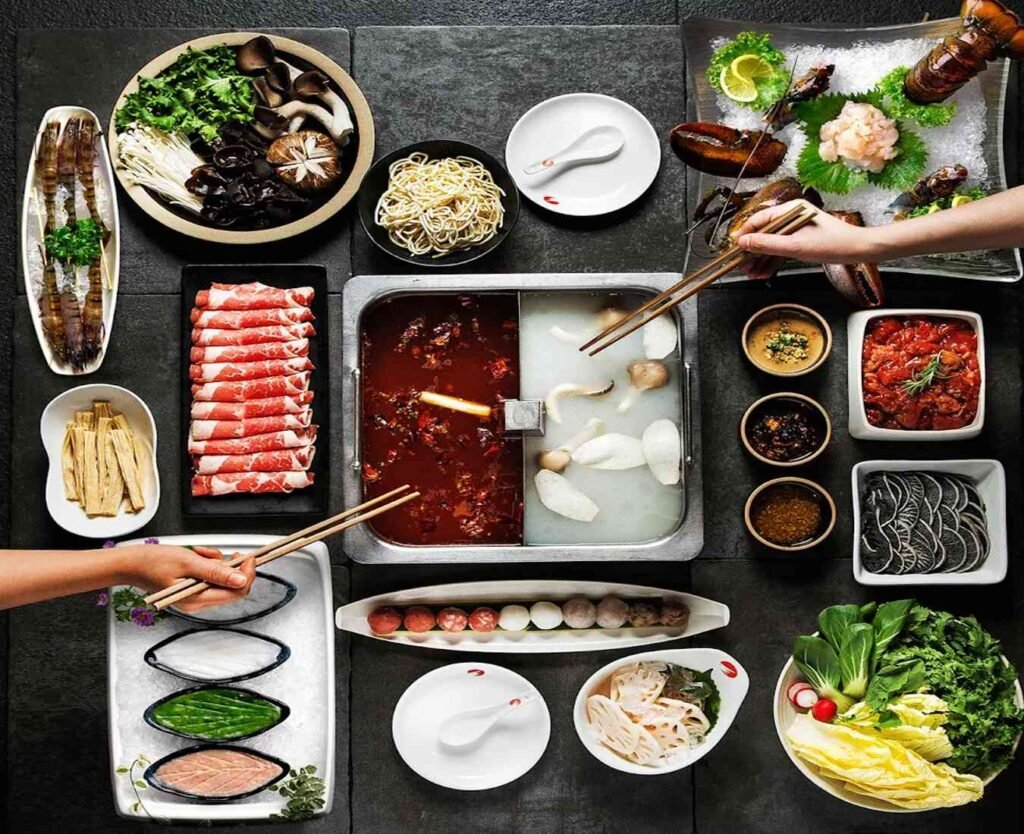 Fresh meat, seafood and vegetables with Spicy Sichuan and Mushroom broths at Haidilao Hot Pot, Pavilion Elite, Bukit Bintang, Kuala Lumpur