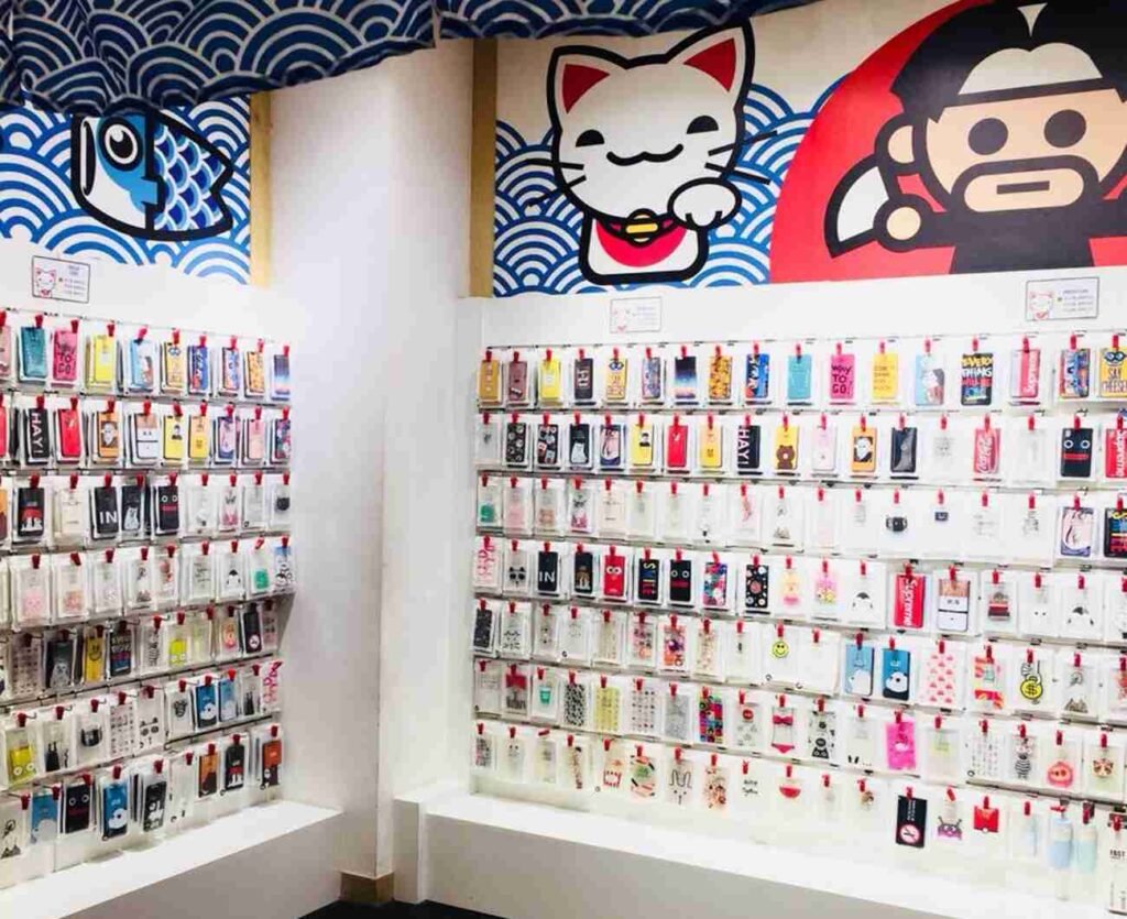 A diverse collection of phone cases featuring trendy and charming designs on display at Nigio, Tokyo Street Pavilion Kuala Lumpur.