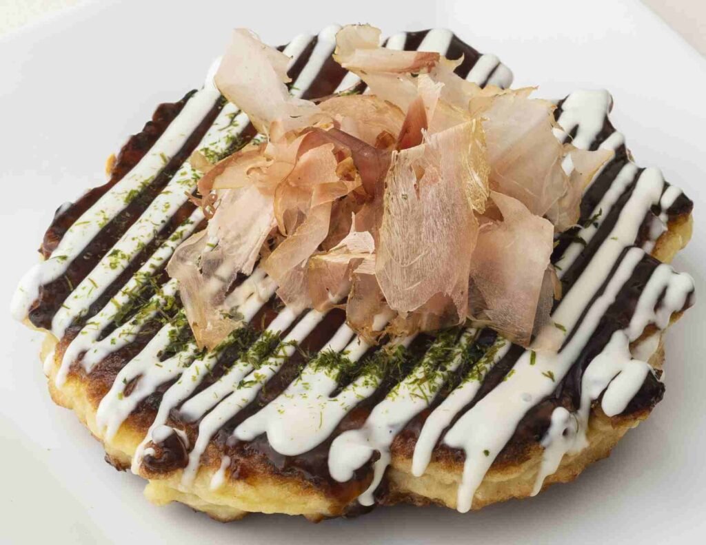 Okonomiyaki, a savoury, Japanese-style pancake with Yamato potatoes, shredded cabbage and crispy pork belly on top, is a signature dish by Chef Takeshi Wada at Okonomi by Tokyo Don, Tokyo Street Pavilion Kuala Lumpur