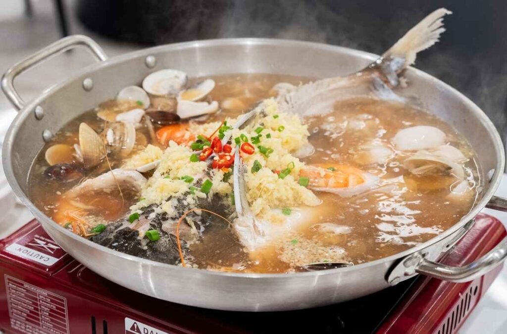 Signature Steam Three Treasures With Fish, made with specialty broth, steamed clams, squids, fresh prawns, and fresh fish at Siong Tong Gai, Dining Loft Pavilion Kuala Lumpur