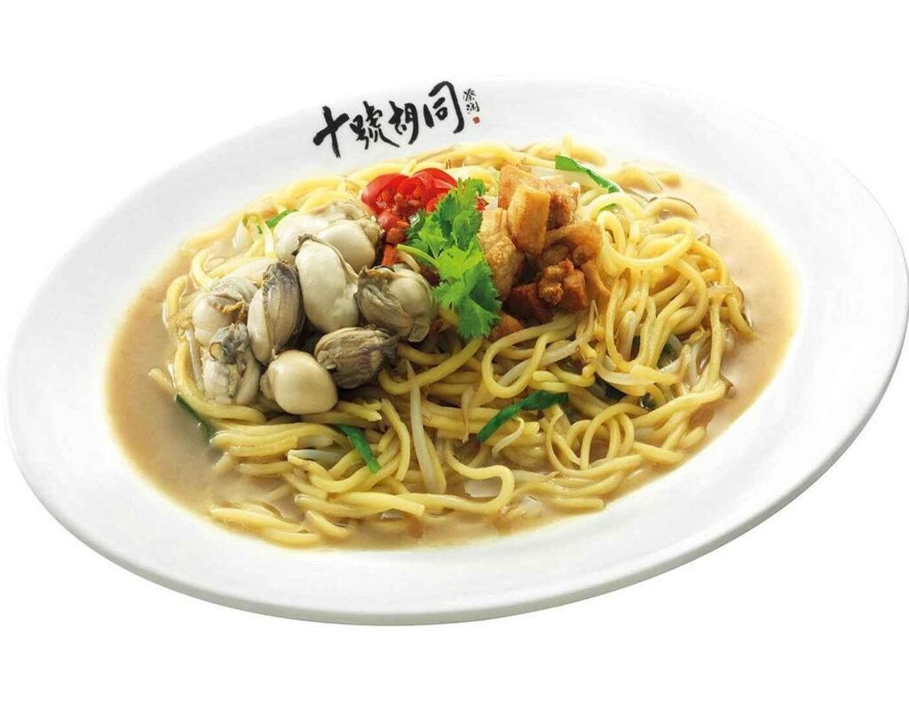 A classic street food favourite across Taiwan, Singapore and Malaysia, the Signature Oyster Noodle at Kong Tai, Lot 10 Hutong Kuala Lumpur features thick yellow noodles in savoury brown gravy with egg, plump oysters, fried shallots, and coriander.
