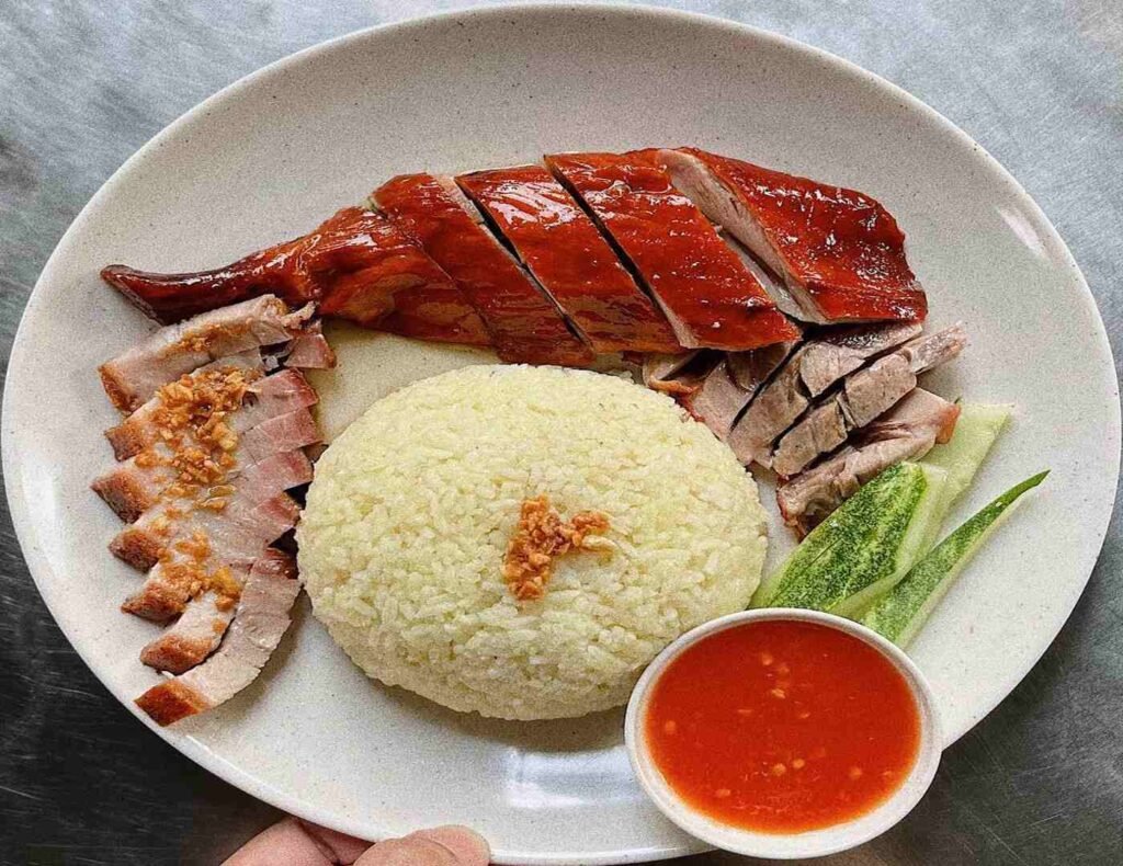 The Threesome Platter (Sam Ping Fan) consists of Signature Roasted Duck, Roasted Pork Belly (SiuYuk), Honey Glazed Pork (ChaSiu), a portion of aromatic Hainanese rice, freshly cut cucumber and chilli sauce. A crowd favourite at Roast Duckking, Lot 10 Hutong.