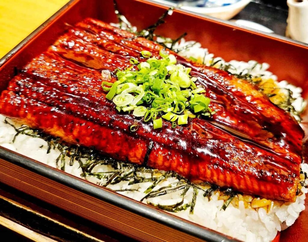 The Unajyu Hitsumabushi features a grilled eel with a crispy exterior and tender interior served on a bed of rice in a lacquered box (jubako). A signature dish at Touan Japanese Restaurant, The Table @ Isetan The Japan Store, Lot 10, Bukit Bintang, Kuala Lumpur.