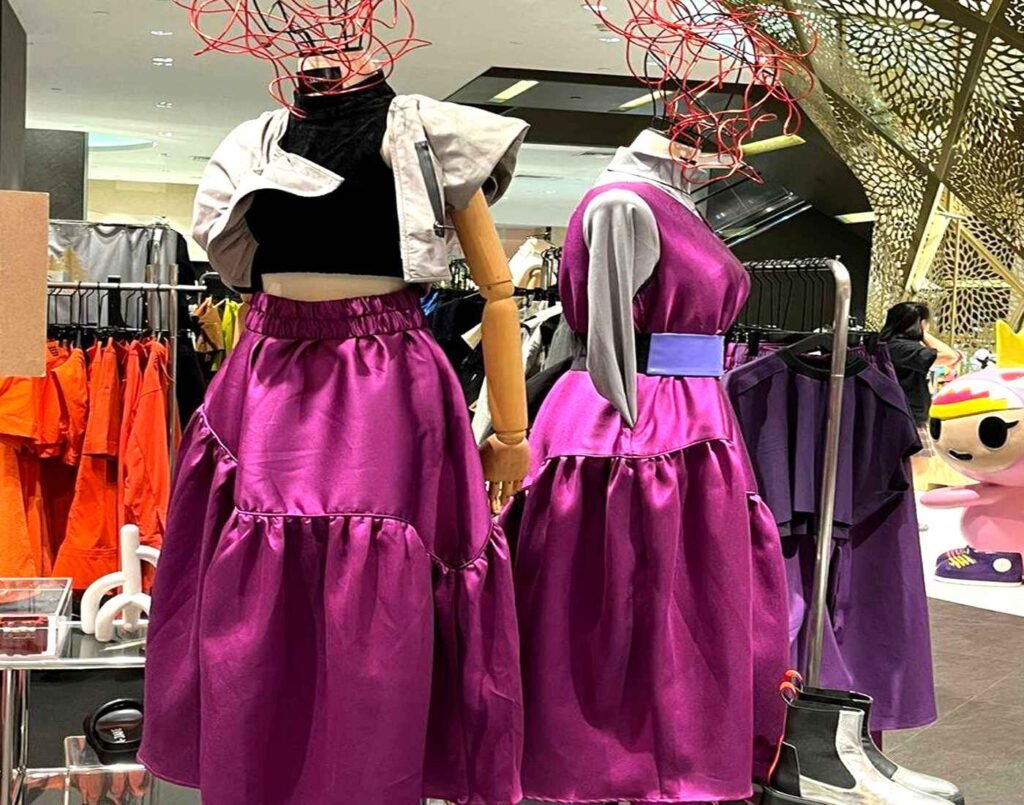 Avant-garde purple dresses with bold silhouettes displayed on mannequins at A-Jane, a Malaysian fashion brand blending sound-inspired concepts with experimental design, located at The Design, Lower Ground Floor, Isetan The Japan Store Lot 10, Bukit Bintang, Kuala Lumpur.
