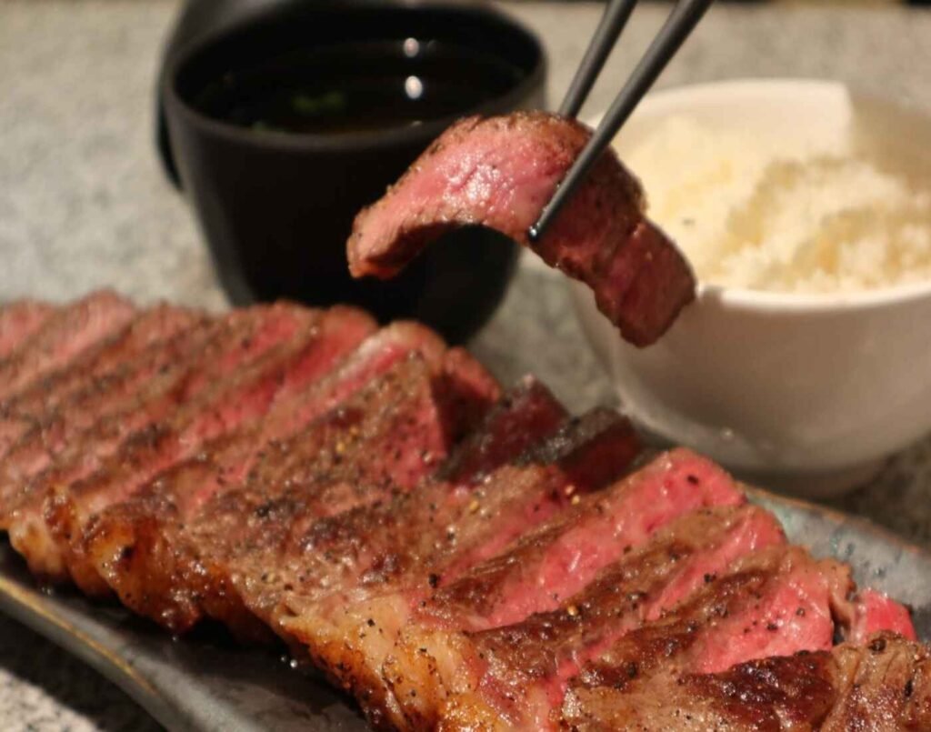 Grilled Karubi slices of Australian Wagyu Steak, a highly rated dish at Tamaruya Meat Master, a unique steak-by-weight concept where you handpick premium cuts like Miyazaki Wagyu, Japanese Wagyu sirloin, or tender Angus beef, and have them expertly grilled on-site for a minimal RM10 cooking fee, located at The Market, Lower Ground Floor, Isetan The Japan Store Lot 10, Bukit Bintang, Kuala Lumpur.