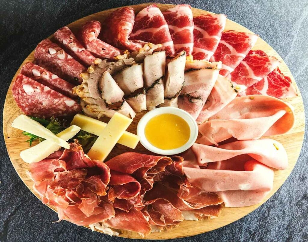 Tagliere Di Affettati E Formaggi (Cold Cuts & Cheese Platter) is a selection of imported Italian cold cuts (pork) and cheese served with homemade honey dew jam, bread and pickles. A highly rated dish at Luretta DOP Italian Deli, An Italian deli-café featuring rustic Emilia-Romagna specialties, artisan deli goods and award-winning Luretta vineyard wines, located at The Market, Lower Ground Floor, Isetan The Japan Store Lot 10, Bukit Bintang, Kuala Lumpur.