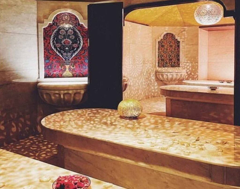 The Moroccan steam chamber at Hammam Spa, featuring golden lanterns, intricate mosaic wall designs, carved stone water basins, and heated Carrara marble slabs which opens pores and relaxes the body for deep exfoliation. Located at The Wellness, Second Floor, Isetan The Japan Store Lot 10, Bukit Bintang, Kuala Lumpur.