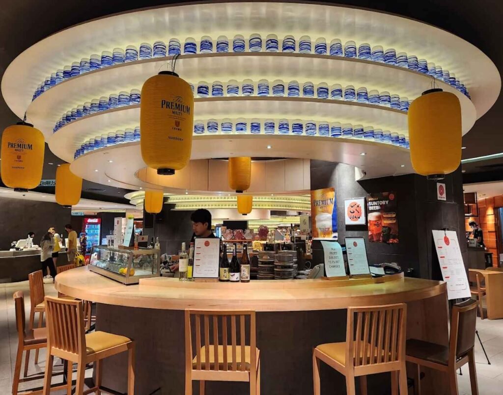 Japanese eateries featuring kaunta seki dining bars or bar counter-style seating, where food is prepared in front of diners who are seated on tall chairs at The Market, Lower Ground Floor, Isetan The Japan Store Lot 10, Bukit Bintang, Kuala Lumpur.