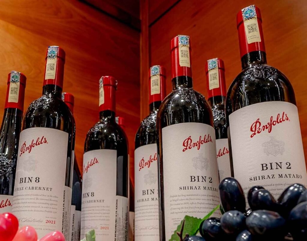 Bottles of Penfolds Bin 2 & Bin 8 on display at City Cellar, located at The Market, Lower Ground Floor, Isetan The Japan Store Lot 10, Bukit Bintang, Kuala Lumpur. Penfolds Bin 2 is a Shiraz–Mataro blend with a soft, medium-bodied profile of plum and redcurrant, offering earthy, savoury qualities from the Mataro, while Bin 8 is a Shiraz–Cabernet blend recognized for bold, ripe dark fruit flavours balanced by cedar and chocolate with a smooth, spicy finish, the primary difference being the grape composition and resulting flavour profile.