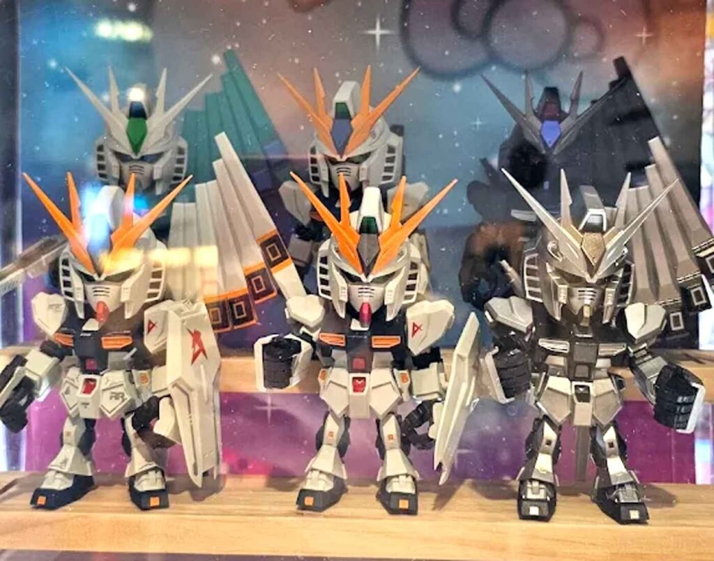 Bandai Namco QMSV Mini RX-93 V Gundam "Cute Mobile Suit Variations" series figures featuring detailed mobile suit designs from the Gundam anime series displayed among Japanese collectible toys at Don Don Donki Lot 10.
