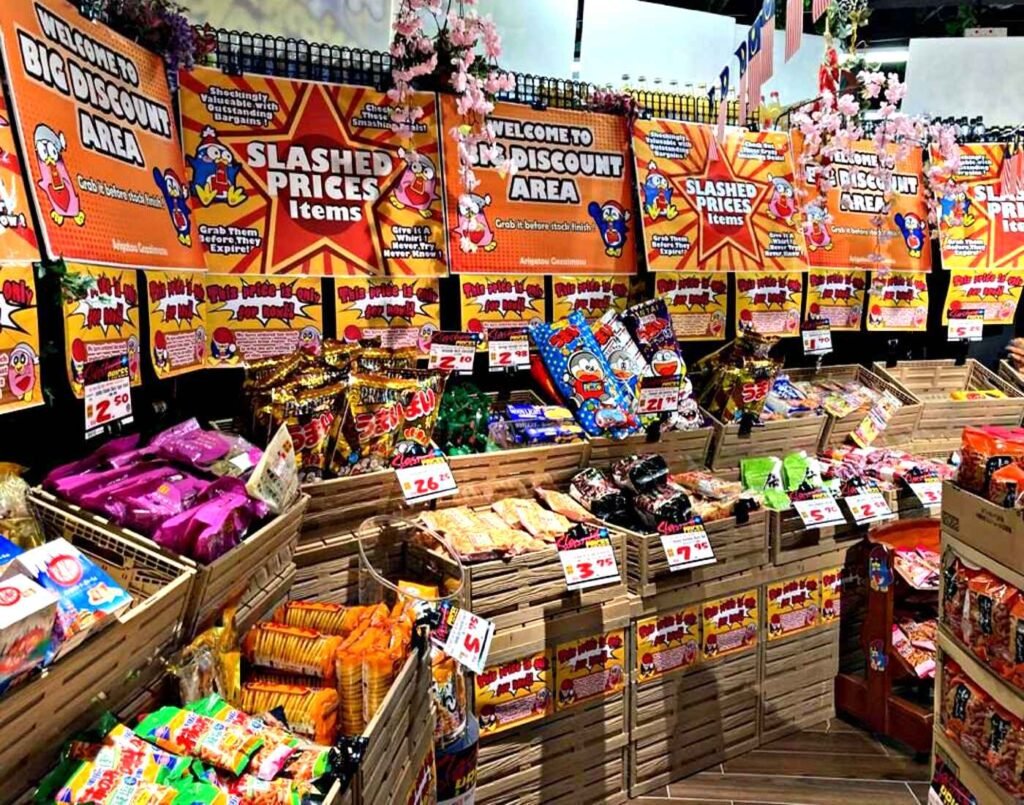 Crates of Japanese rice crackers including senbei, arare, mamegashi and okaki in various pack sizes displayed at the Big Discount Area with reduced prices at Don Don Donki Lot 10 in Bukit Bintang, Kuala Lumpur.
