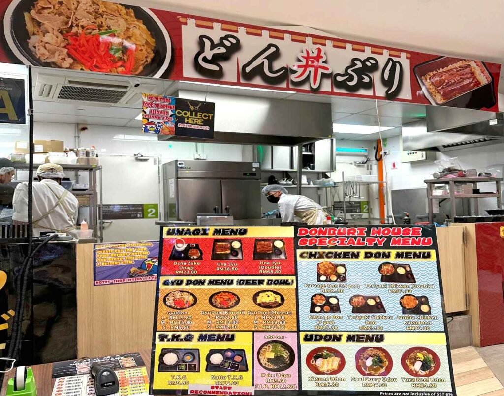 Donburi House outlet counter and kitchen with chefs preparing rice and udon bowls for dine-in customers on the 2nd floor of Jonetz By Don Don Donki Lot 10, a Japanese supermarket in Bukit Bintang, Kuala Lumpur.
