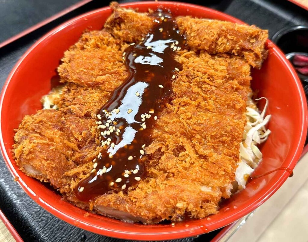 The Jumbo Chicken Katsu Don, featuring crispy breaded chicken cutlet served over steamed rice with savoury sauce, bean sprouts and spring onions. A crowd favourite at Donburi House in Jonetz By Don Don Donki Lot 10, a Japanese supermarket in Bukit Bintang, Kuala Lumpur.