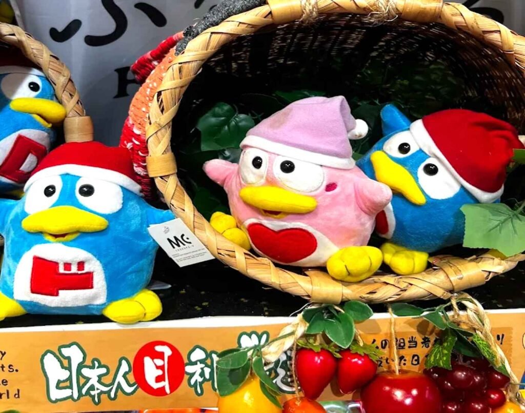 Donpen and Donko mascot plush toys by Don Quijote displayed in baskets in the Kawaii Corner of Don Don Donki Lot 10, Bukit Bintang, Kuala Lumpur.