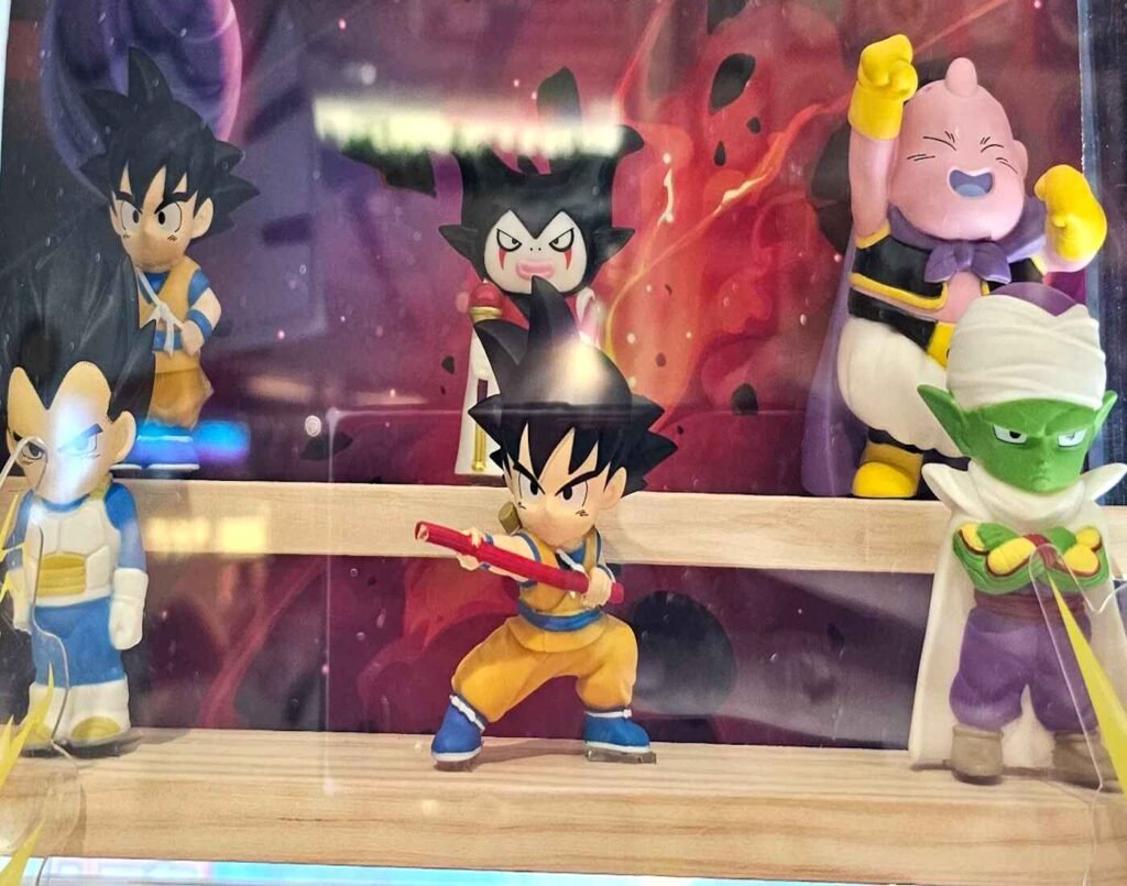 Dragon Ball Daima collectible anime figures featuring Son Goku, Vegeta, Gomah, Majin Buu, and Piccolo displayed among Japanese toys on the 2nd floor of Don Don Donki Lot 10, a Japanese supermarket in Bukit Bintang, Kuala Lumpur.