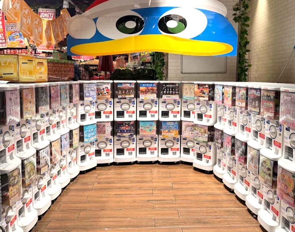 Rows of colourful gashapon vending machines featuring Japanese collectible capsule toys at Jonetz By Don Don Donki Lot 10, a Japanese supermarket in Bukit Bintang, Kuala Lumpur.