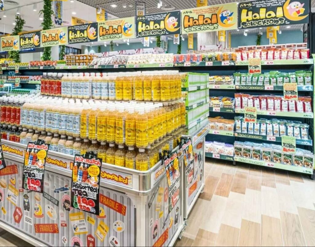 Wide view of the ‘Halal Selections’ aisle with shelves of halal-certified Japanese snacks, instant noodles, drinks and pantry items at Jonetz By Don Don Donki Lot 10, a Japanese supermarket in Bukit Bintang, Kuala Lumpur.