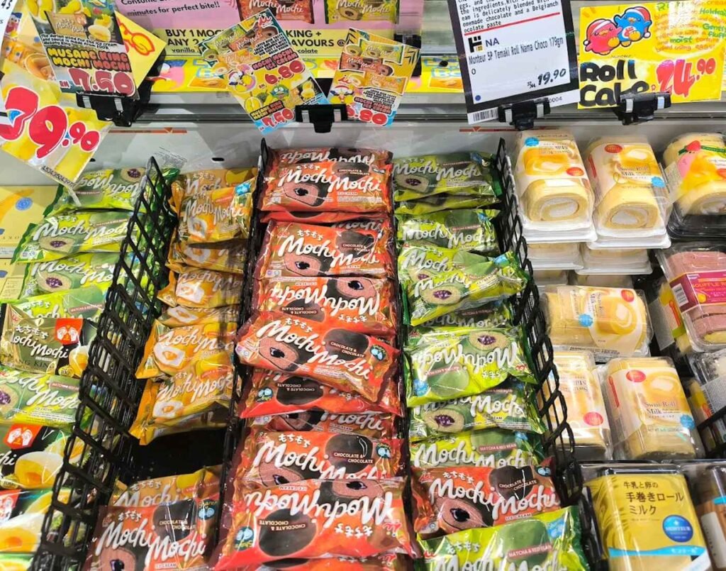 Japanese desserts including mochi, roll cakes, Swiss rolls and chilled sweets displayed in a refrigerated dessert section at a Japanese supermarket Kuala Lumpur, Don Don Donki Lot 10.