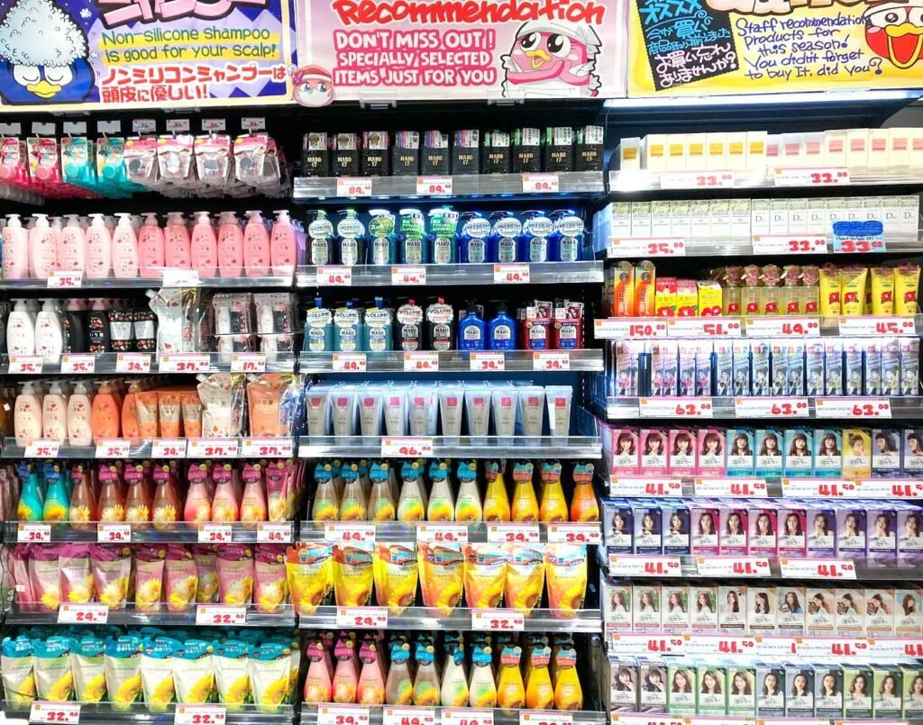 A full aisle of Japanese hair care products including Moist Diane shampoos, MARO men’s scalp care, HIMAWARI sunflower hair care by Kracie, and Liese hair colour kits, displayed at Don Don Donki Lot 10 in Bukit Bintang, Kuala Lumpur.