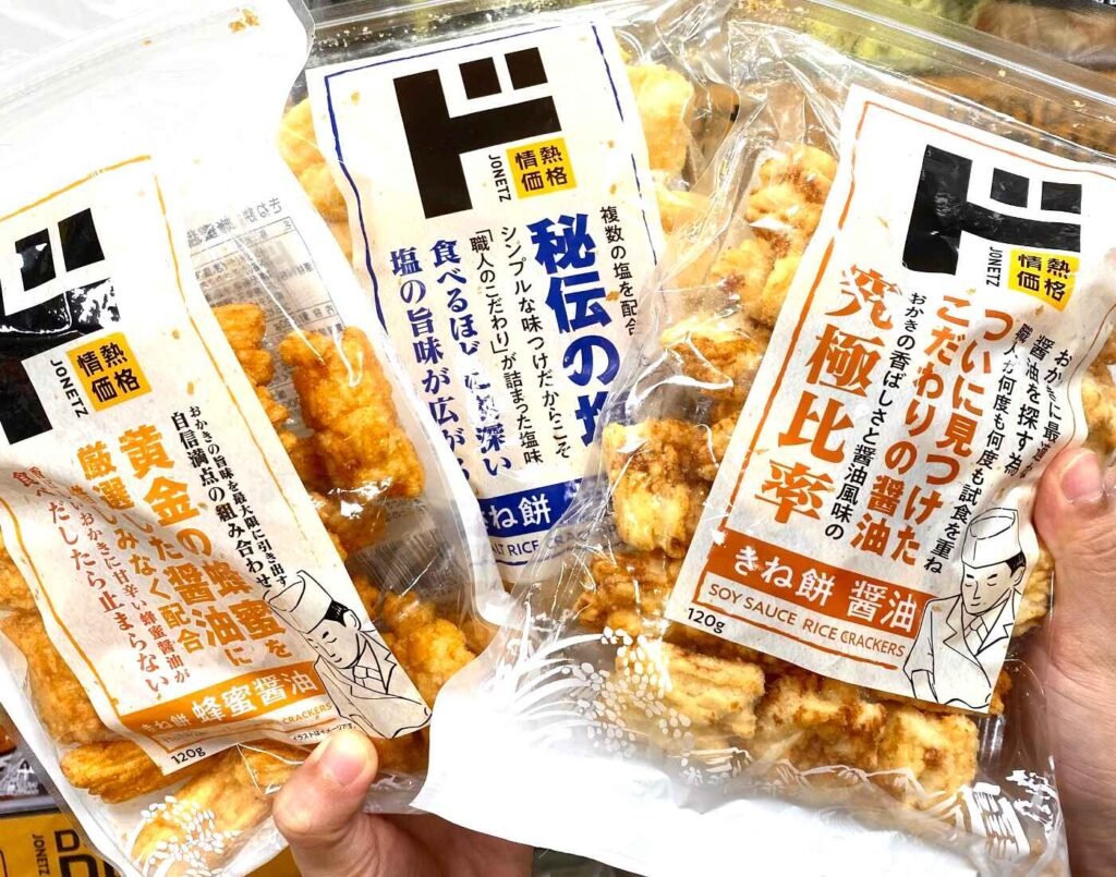 Three variants (Honey & Soy Sauce, Salt, and Soy Sauce flavours) of Kinemochi rice crackers by the Jonetz Kakaku brand, a private label of Don Quijote, available at Jonetz By Don Don Donki Lot 10, a Japanese supermarket in Bukit Bintang, Kuala Lumpur.