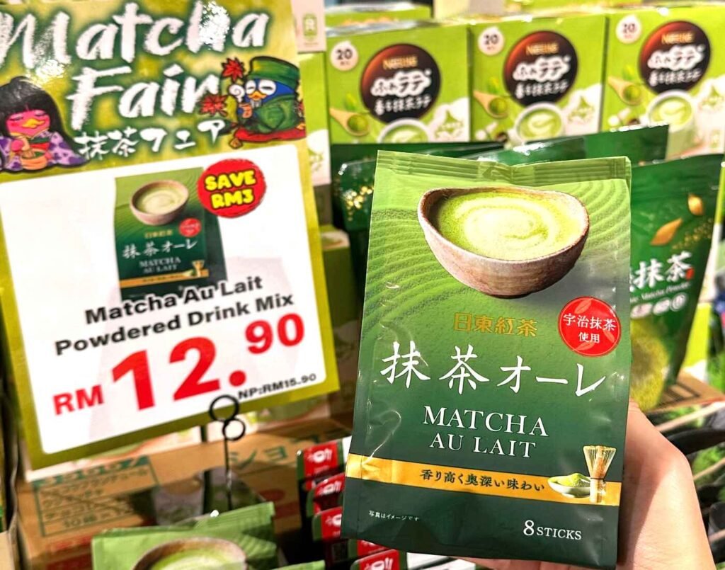 Nittoh Tea Matcha Au Lait instant powdered drink mix (8 sticks), made with Uji matcha and milk, displayed with a Matcha Fair promotional price of RM12.90 at Jonetz By Don Don Donki Lot 10, a Japanese supermarket in Bukit Bintang, Kuala Lumpur.