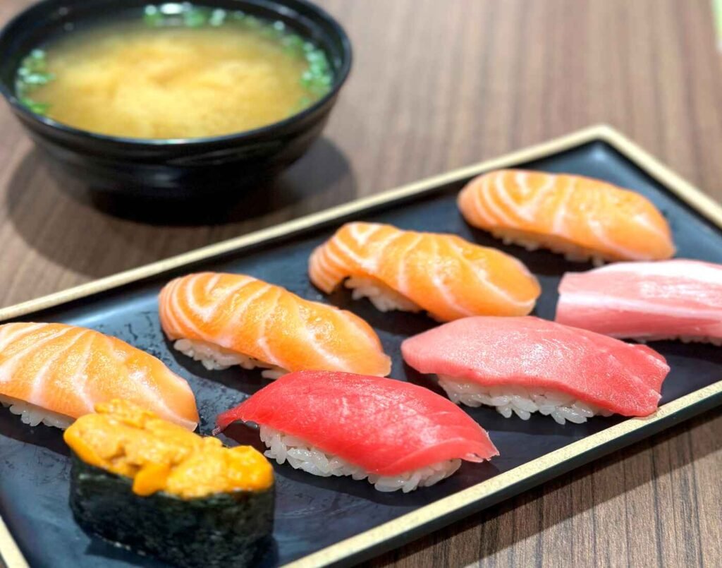 Sakura Sushi Set at Don Don Donki Lot 10 featuring uni (sea urchin), otoro, and premium salmon nigiri.