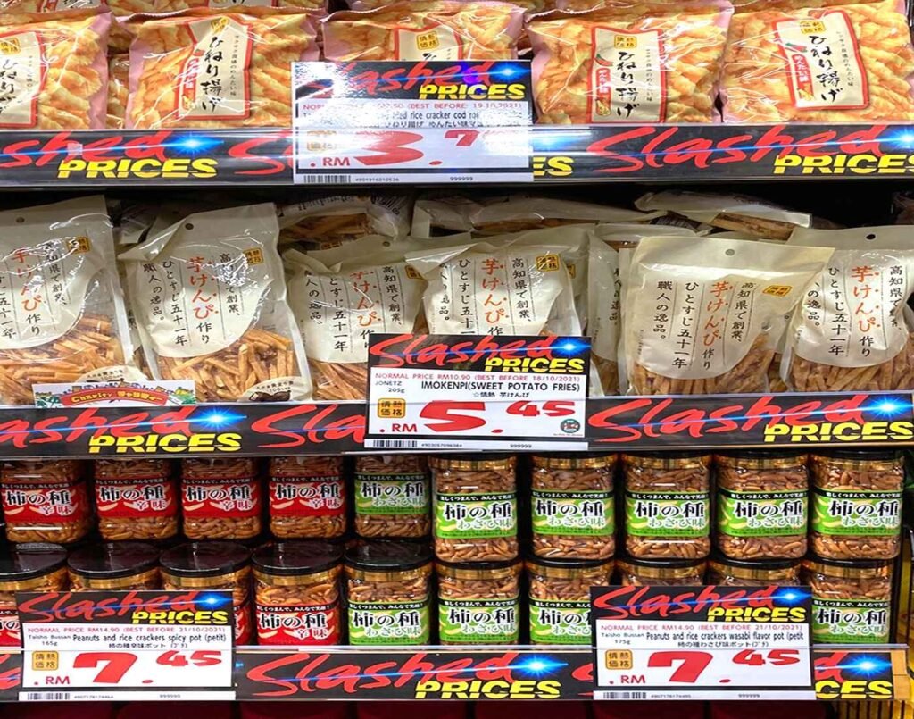 Savoury snack shelves featuring Japanese favourites like sweet potato fries, organic peanuts, wasabi flavoured rice crackers and many more at Jonetz By Don Don Donki Lot 10, a Japanese supermarket in Bukit Bintang, Kuala Lumpur.