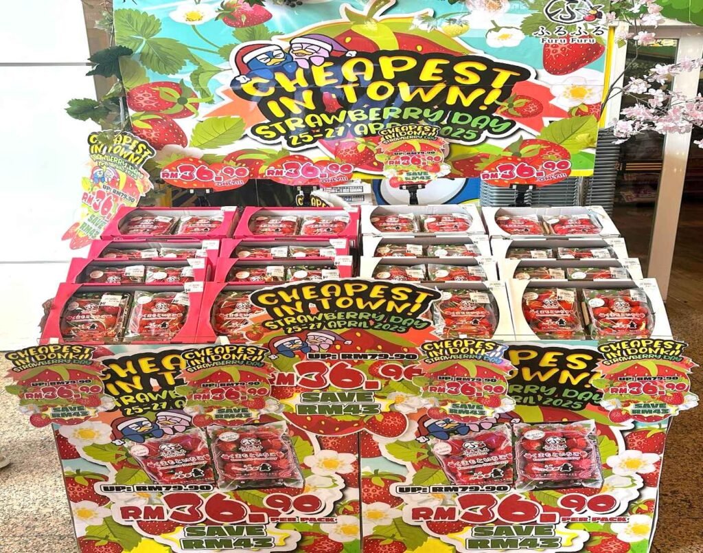 Strawberry Day promotion display showing discounted Japanese strawberries with “Cheapest in Town” signage and price reduction from RM79.90 to RM36.90 at Don Don Donki Lot 10 in Bukit Bintang, Kuala Lumpur.