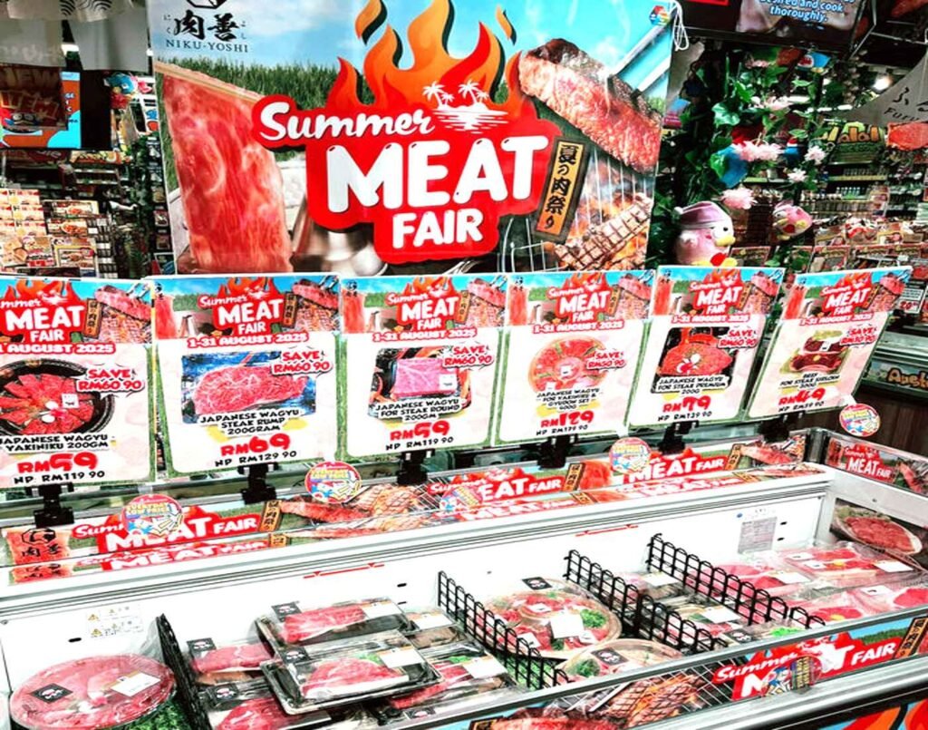 Premium Japanese wagyu beef cuts displayed in a chiller under the Summer Meat Fair promotion with discounted prices at Don Don Donki Lot 10 in Bukit Bintang, Kuala Lumpur.