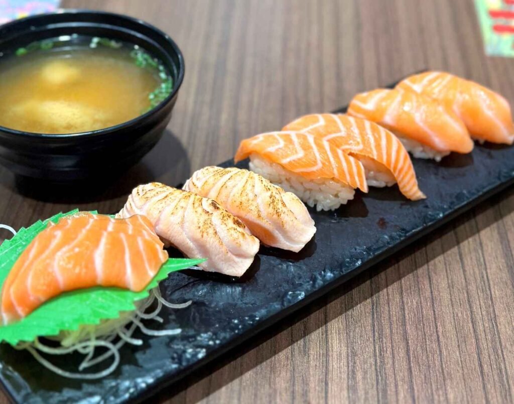 Uohama Salmon Zukushi sushi set featuring fresh salmon nigiri and flame seared aburi salmon sushi served with miso soup at Don Don Donki Lot 10 in Bukit Bintang, Kuala Lumpur.